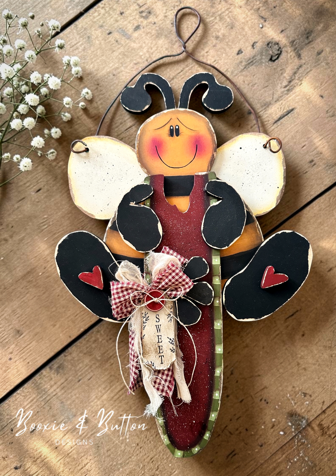 Hanging bee with watermelon and garden shovel