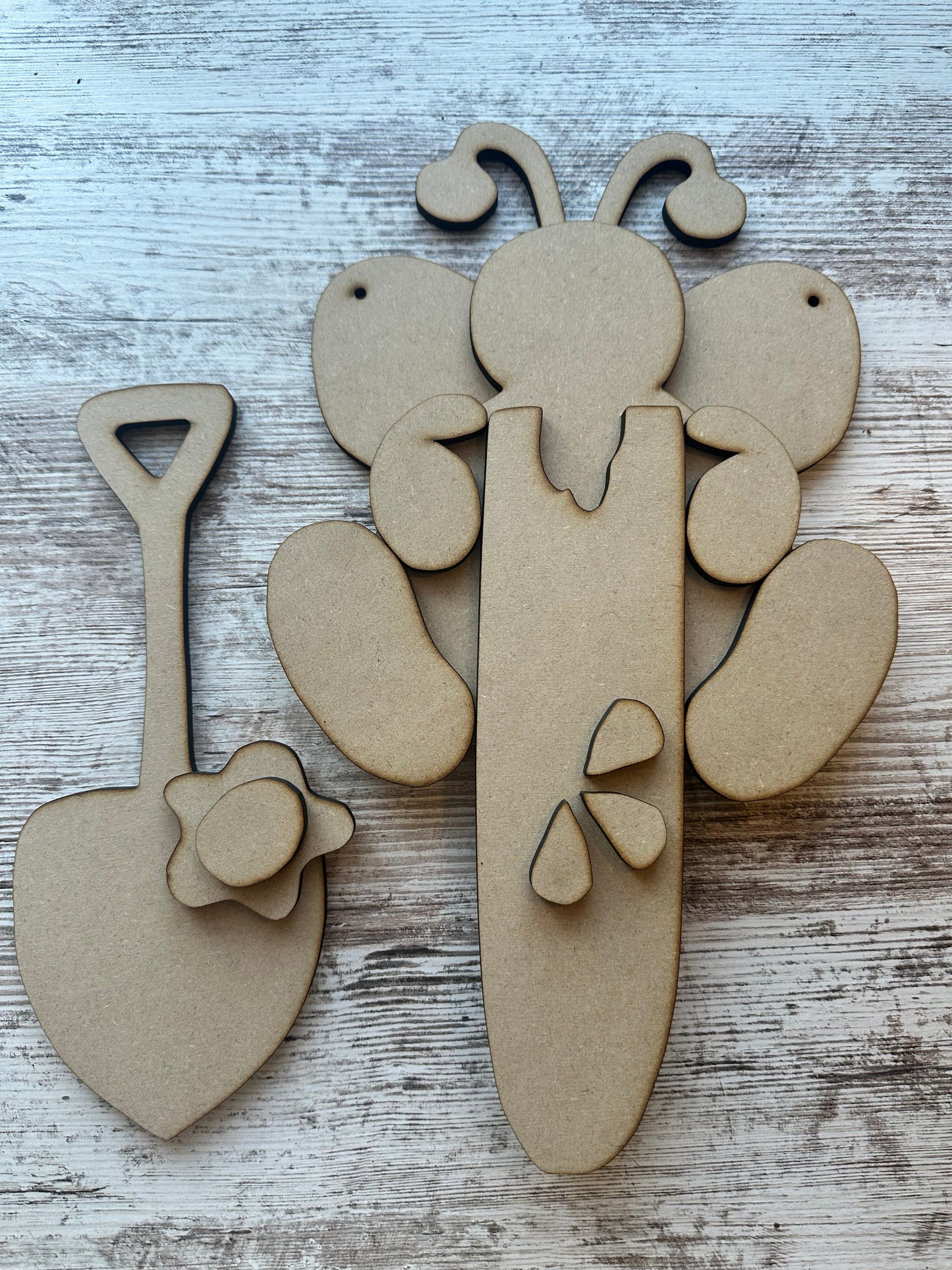 Hanging bee with watermelon and garden shovel