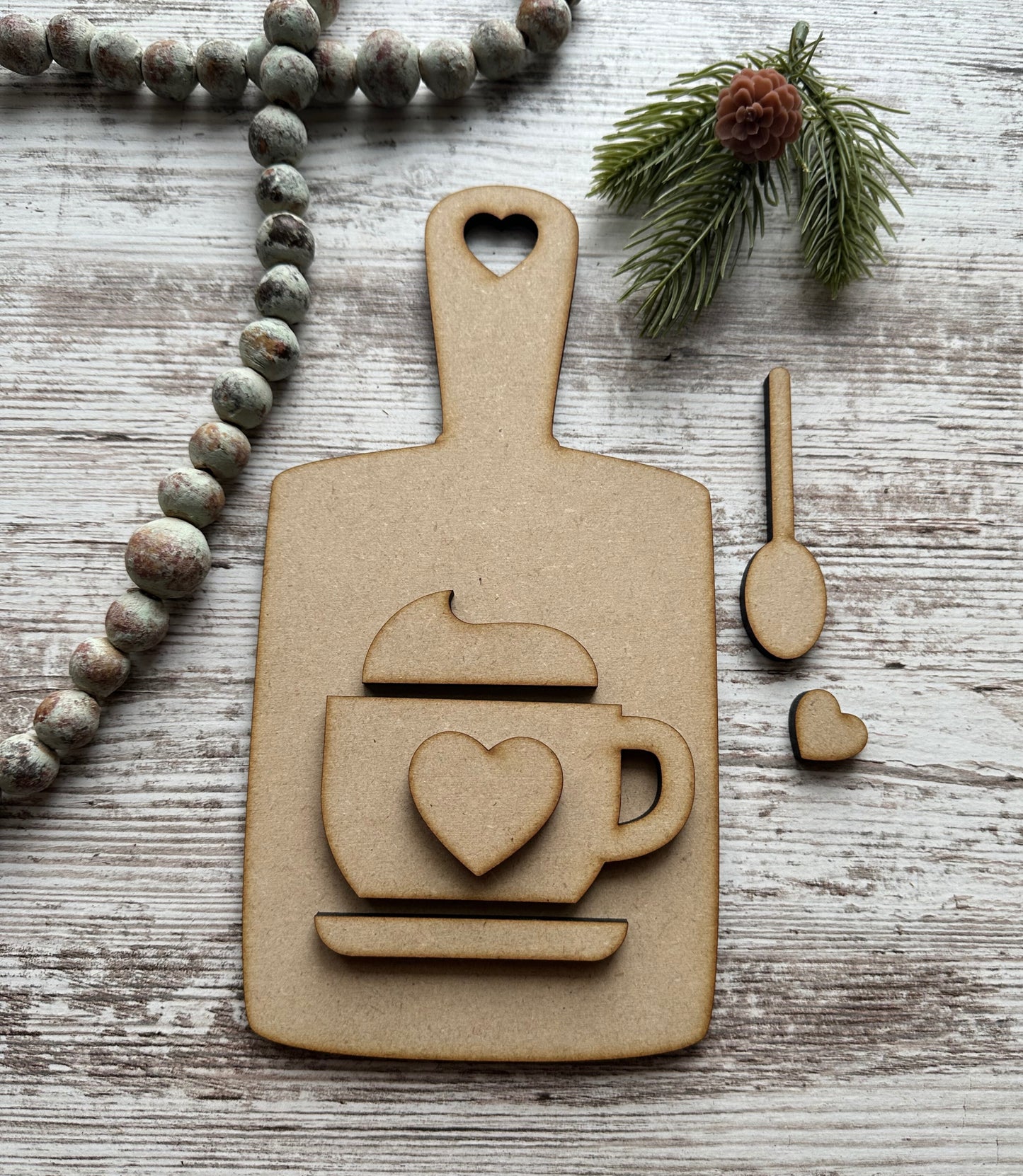 Cutting board with hot cocoa and spoon